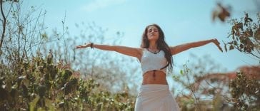 woman spreading both her arms stockpack pexels scaled