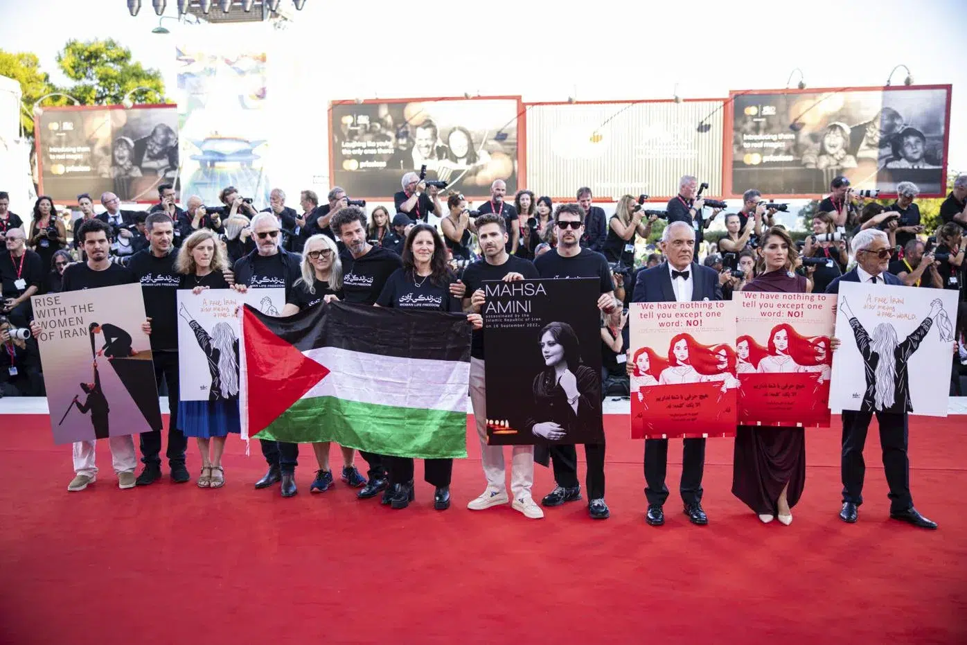A Flashmob at Venice Film Festival's Red Carpet Solidarity for Iran with Palestinian Flags and Representation